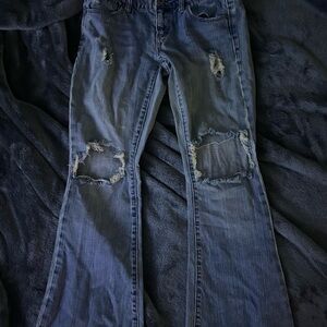 Distressed Blue Denim Jeans